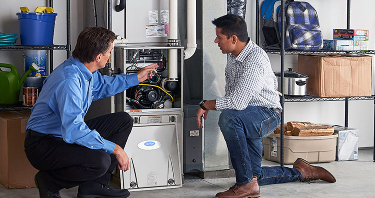 two men troubleshooting des moines furnace