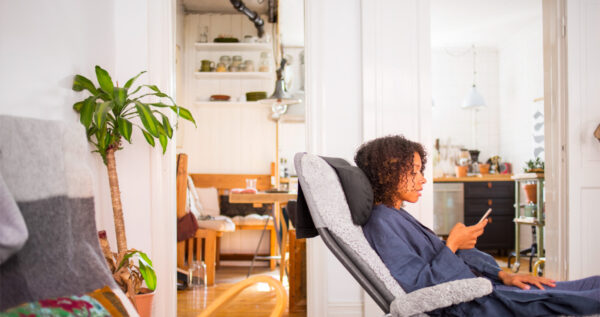 Woman Relaxing In Home Enjoying Benefits Of Improve Air Quality In Des Moines Iowa