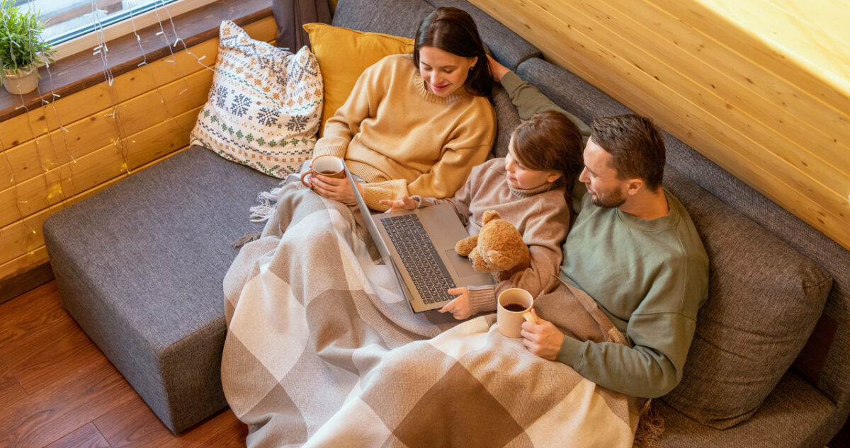 Family Relaxing On A Couch During The Fall In Des Moines Iowa