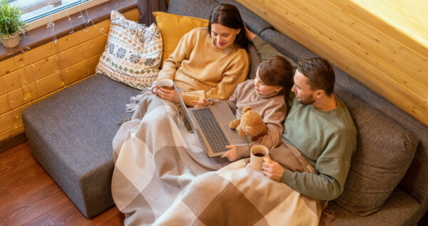 Family Relaxing On A Couch During The Fall In Des Moines Iowa