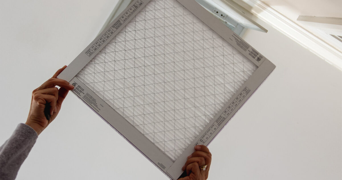 Homeowner Changing Merv Rated Air Filter In Des Moines