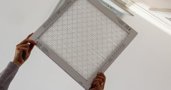 Homeowner Changing Merv Rated Air Filter In Des Moines